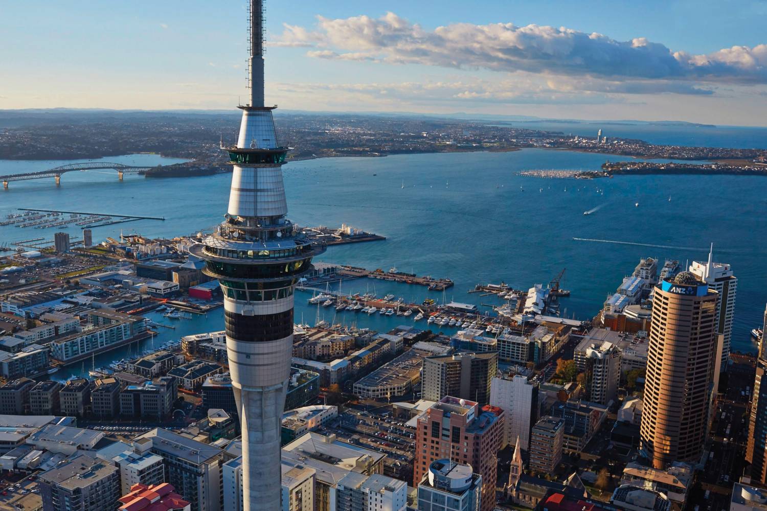 Auckland – View of Sky Tower and Auckland City (Pure Discoveries) Auckland city skyline and harbour from above