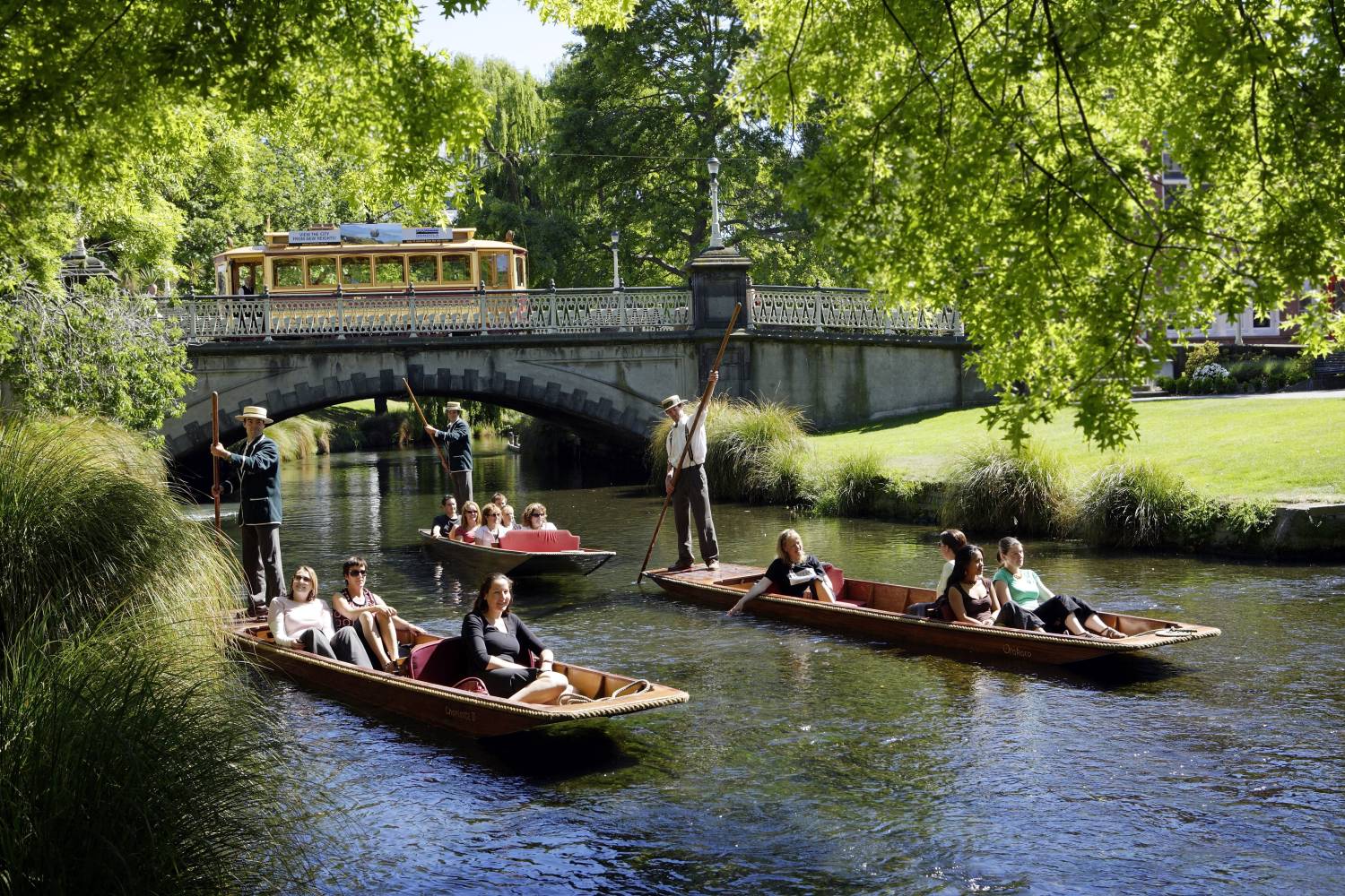 Punting at Worcester Bridge with Tram in background, Christchurch (Pure Discoveries)